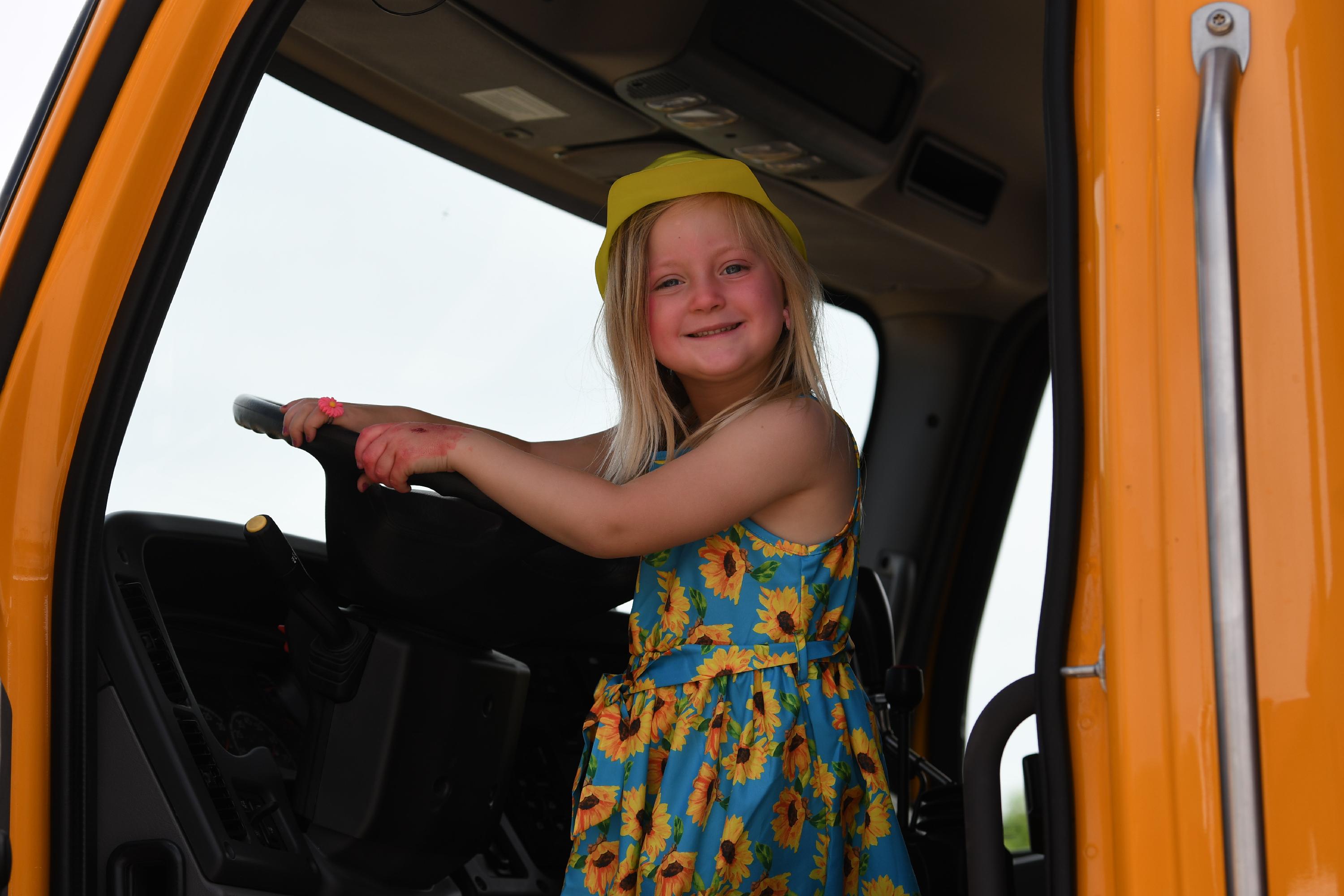 girl driving a big truck